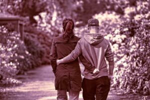 person, people, man, woman, couple, two, two people, together, arms, arms around, walking, motion, park, people, people, couple, couple, couple, couple, couple, two people, walking